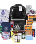 All-In-One Emergency Survival Kit For Four People With 72-Hour Supply Pack Including Food, Water, 85-Piece First Aid Kit, Shelter Gear And Warmth In Premium Black Backpack For Fires, Earthquakes, Hurricanes, Floods, Tsunamis displayed.