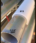 Pro Series Snap Clamps 1 Inch 20 Pack Gray Snap Clamps With Rounded Edges For Safer Fabric And Plastic Ideal For Attaching Tarps Or Netting To Pipe Or EMT Highly Compatible With Many Pipe Types shown installed on EMT pipe with metal texture.