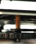Side view of a yellow Light Load 8mm OD 20mm Long Die Spring Mold for Ender 3 bed 3D printer, showcasing installation.