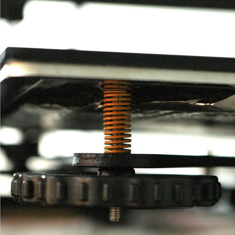 Side view of a yellow Light Load 8mm OD 20mm Long Die Spring Mold for Ender 3 bed 3D printer, showcasing installation.