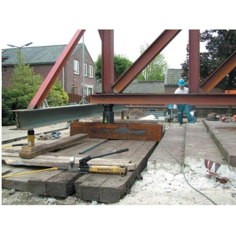 Enerpac P-392 2 Speed Lightweight Hand Pump in use for lifting steel beams at construction site