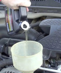 Pouring Heavy Duty Hyper Lubricant Engine Treatment For All Oils And Engines 32 Ounce Bottle Single into car engine