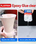 Clear Two Part Epoxy Glue For Plastic Metal Wood Ceramic And More Multipurpose Waterproof Adhesive shown curing on ceramic vase