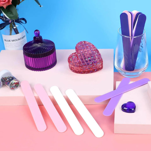 Epoxy Resin Stir Sticks Set 20 PVC Mixing Sticks In 4 Colors Reusable Plastic Stirrers on a tabletop scene