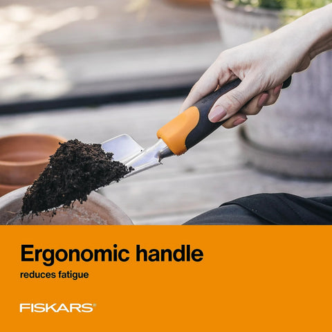 Person using Heavy Duty Gardening Hand Trowel With Hang Hole For Digging And Planting Cast Aluminum Rust Resistant Head to scoop soil