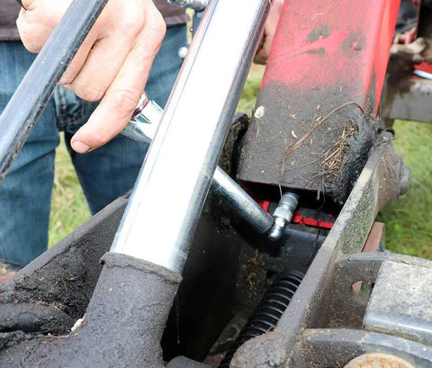 Person using Ergonomic 90 Degree Grease Coupler Adapter For Easy Lubrication In Tight Spaces No Mess And Durable Leak Free Fits From LockNLube