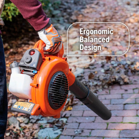 Person holding a Powerful 28cc Gas Leaf Blower With 1.1 HP Two Cycle Engine, 470 CFM Air Volume And 170 MPH Air Velocity on a walkway.