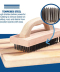 Ergonomic Steel Butcher Block Scratch Brush, 9-3/8” with tempered bristles on wooden cutting board