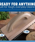 Ergonomic Steel Butcher Block Scratch Brush, 9-3/8” with wooden handle and bristles on counter.