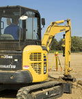 Excavator on construction site with LR30W Laser Display Receiver with 360 Degree Reception mounted for grading and surveying.
