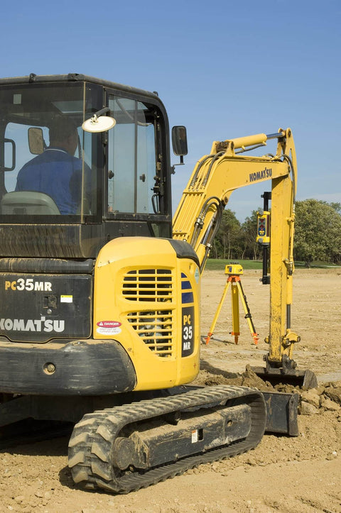 Excavator on construction site with LR30W Laser Display Receiver with 360 Degree Reception mounted for grading and surveying.