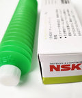 Excella Green NS7 Low Torque Synthetic Grease tube next to NSK branded box, ideal for high speed linear guides and ball screws.