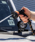 Expandable Garden Hose Copper Bullet With Ten Pattern Thumb Spray Nozzle As Seen On TV 650 PSI in use on a car windshield.
