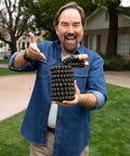 Person holding Expandable Garden Hose Copper Bullet With Ten Pattern Thumb Spray Nozzle As Seen On TV 650 PSI Lead Free.
