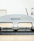 Front view of Bostitch EZ Squeeze 3 Hole Punch 20 Sheet Capacity No Jam Technology Reduced Effort Metal Body Integrated Ruler.
