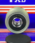 Front view of F-560201 Alternator Pulley for Hyundai SANTA FE II (CM) with one-way clutch on striped display background.