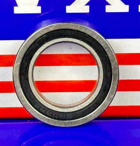 F6803-2RS Flanged Sealed Ball Bearing ID 17mm x OD 26mm x 5mm, rubber seal and chrome steel design, front view.