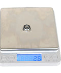 F695-2RS Flanged Ball Bearing ABEC-9 on digital scale showing weight, 5x13x4mm, chrome steel, for high speed motors and 3D printers