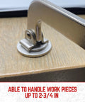 Close-up of heavy duty 3 inch face clamp showing steel construction and ergonomic grip on wood surface for woodworking projects.
