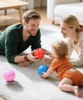 Family playing with 12 Pack Bouncy Ball Knobby Massage Ball, 5" Spiky Sensory Toy for Kids & Adults on a living room floor
