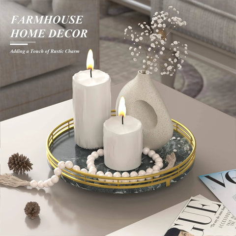 Green marble lazy susan turntable for table top with gold frame displaying candles and a vase.