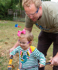 Adult and child wearing UV Protection Safety Goggles with 99 Percent UV Impact Resistant Clear Lenses while using gardening tools outdoors.