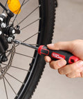 Person using 55-Piece Auto Repair Socket And Bit Set For Home, Car, And DIY Projects With Spark Plug Socket, Adapters, Bit Handle, And All-In-One Tool Kit For Quick Fixes on bicycle
