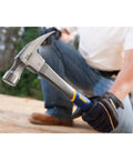 Person using Fiberglass Claw Hammer 16 Oz General Purpose With Forged Steel Head ProTouch Grip Smooth Face for framing on wood surface