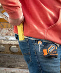 Worker using 6-Foot Folding Ruler 6-Foot Fiberglass With Brick Scale On Reverse And Outside Reading One Sixteenth Inch Graduation Riveted Lock Joints For Woodworking