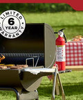 Multi Purpose Fire Extinguisher 1A10BC For Home Office Dorm And Residential Use beside outdoor grill