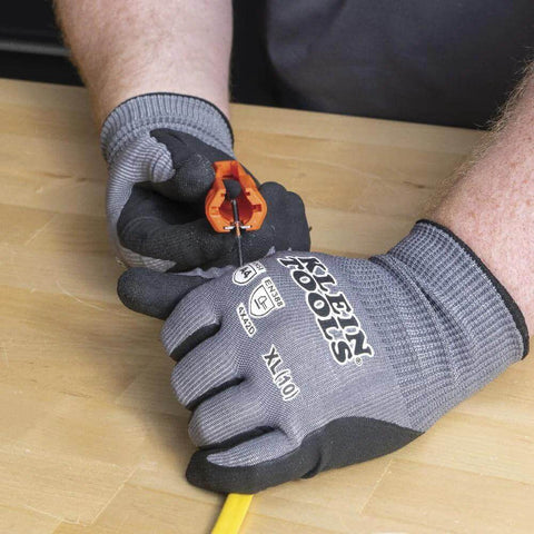 Five In One Cable Stripping Tool For 12 To 14 AWG NM Cable Jacket Slitting And Precision Insulation Stripping in hand use