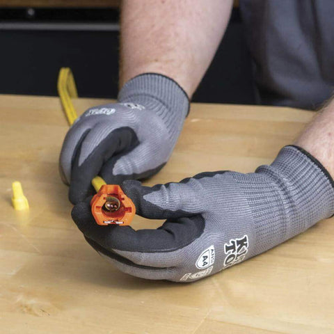 Electrician using Five In One Cable Stripping Tool For 12 To 14 AWG NM Cable Jacket Slitting And Precision Insulation Stripping