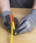 Hands using Five In One Cable Stripping Tool For 12 To 14 AWG NM Cable Jacket Slitting And Precision Insulation Stripping For 12 To 14 AWG Conductors