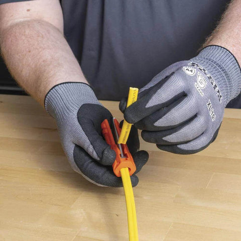 Person using Five In One Cable Stripping Tool For 12 To 14 AWG NM Cable Jacket Slitting And Precision Insulation Stripping For 12 To 14 AWG Conductors
