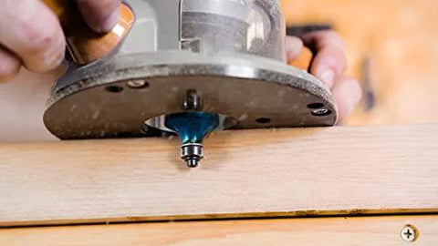 Fixed Base Router 2.25 HP 12 Amp Variable Speed 8000 to 25000 RPM used for precise edge work on wood surface.