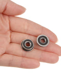 Hand holding two Flanged Ball Bearing F695-2RS 5x13x4mm Double Sealed Chrome Steel ABEC1 Precision Bearings, showcasing size and design.