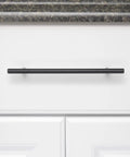 Euro Bar Cabinet Pull Handle Flat Black Finish Three Eighths Inch Diameter Eight Point Six Nine Inch Length Center To Center Six Point Three One Inch With Mounting Hardware Included Ten Pack installed on white cabinet
