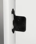 2-Pack 2-inch Overlay Hinge, 1 Pair, Flat Black, installed on white cabinet for smooth adjustment.