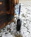 Heavy Duty Flat Free Spring Gate Caster With Universal Mount Eight Inch Wheel on wooden gate outdoors