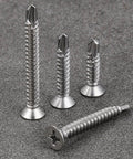 Four stainless steel #8 x 1 inch flat head self tapping sheet metal screws on a gray surface, part of 300pcs set for wood and metal