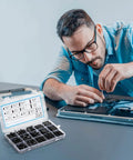 Man using 580 PCS M3 Black Nylon Standoff Kit with Spacers, Screws, and Nuts for motherboard and PCB mounting