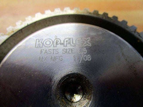 Close-up of New One And A Half Inch 50 Tooth Flex Hub Coupling showing engraved details on metallic surface.