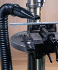 Screw End Quick Coupler For Two And A Half Inch Hose With Left Hand Threaded Adapter attached to shop vac near drill press