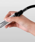 Person holding a Flexible Shaft Grinder Carver Rotary Tool Set with a precision attachment for crafting.