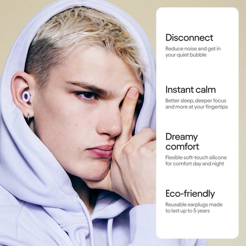Person wearing ultra comfortable, reusable ear plugs engineered for sleep, study, travel and quiet moments, featuring flexible silicone.
