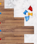 Flooring Spacers Kit With 1/4 Inch And 1/3 Inch Gaps For Wall Positioning, stable triangle design, shown with laminate planks, blue pieces visible