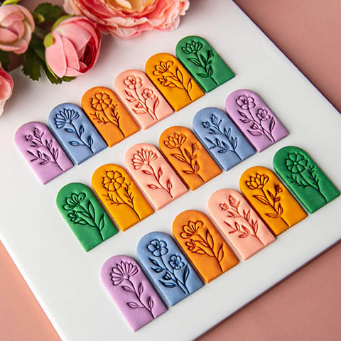 7 Piece Soft Clay Leaf Cutter Mold Set For Flower Stamps And Floral Earrings Making Tools Jewelry Craft Kit For DIY Artists Plastic Jewelry Molds displayed on a pink surface