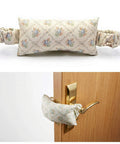 Soft Fabric Door Stopper For Handles With Floral Design Keeps Doors From Slamming And Pinching Fingers Quiet Door Silencer Kid And Pet Safe Farmhouse Style Home Decor, shown installed on a wooden door handle.