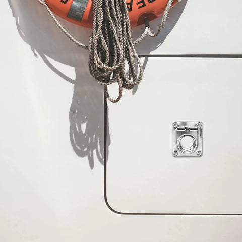 Stainless steel flush pull ring handle installed on boat deck with square mounting plate and four screws