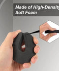 Hand holding high-density foam piece from Eight Piece Foam Door Stopper And Pinch Guard Set For Kidproof And Pet Safety Easy Install